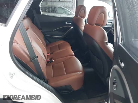 2015 Hyundai Santa Fe with VIN 5XYZWDLA2FG257231, listed as a IAAI auction lot 41868240 with 218,321 mi miles and . Bid and sale history available at DreamBid. Image 8.