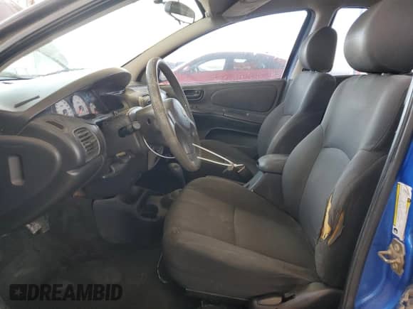 2005 Dodge Neon SXT with VIN 1B3ES56C75D229727, listed as a Copart auction lot 79717284 with 152,739 mi miles and Salvage title. Bid and sale history available at DreamBid. Image 7.
