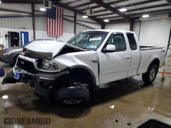 2002 Ford F-150 XL with VIN 2FTRX18L92CA91661, listed as a Copart auction lot 82144845 with Not provided miles and Salvage title. Bid and sale history available at DreamBid. Image 1.
