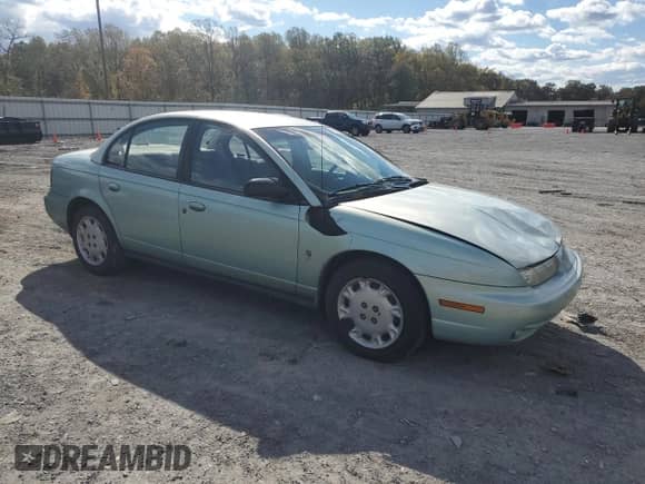 1997 Saturn SL с VIN 1G8ZK5274VZ271990, выставлен на аукционе Copart как лот 87279155 с пробегом 147 825 миль миль и Списание • Salvage title. История ставок и продаж доступна на DreamBid. Изображение 4.