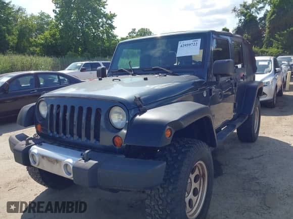 2008 Jeep Wrangler Unlimited Sahara with VIN 1J4GA59128L607591, listed as a IAAI auction lot 42959722 with 129,564 mi miles and . Bid and sale history available at DreamBid. Image 6.