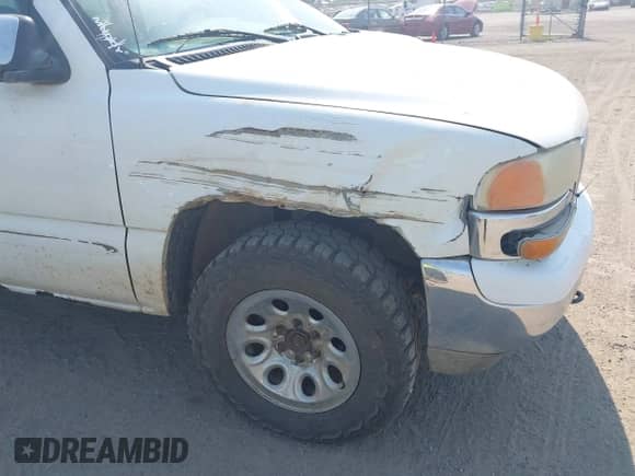 2002 GMC Sierra 1500 SLE z VIN 1GTEK19T12E198855, wystawiony jako IAAI lot #42923074 z przebiegiem 317 702 mil mil oraz . Historia ofert i sprzedaży dostępna na DreamBid. Obrazek 6.