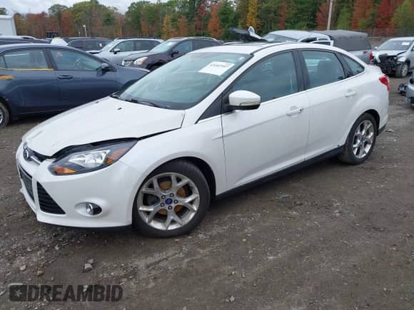 2014 Ford Focus Titanium with VIN 1FADP3J27EL215076, listed as a IAAI auction lot 43442107 with 137,959 mi miles and . Bid and sale history available at DreamBid. Image 2.