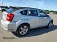 2010 Dodge Caliber SXT with VIN 1B3CB4HA9AD602385, listed as a Copart auction lot 66881324 with 123,370 mi miles and Salvage title. Bid and sale history available at DreamBid. Image 3.