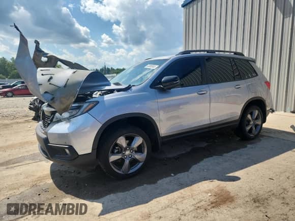 2020 Honda Passport Touring z VIN 5FNYF8H9XLB019275, wystawiony jako Copart lot #63085665 z przebiegiem 54 081 mil mil oraz Szkoda całkowita • Salvage title. Historia ofert i sprzedaży dostępna na DreamBid. Obrazek 1.