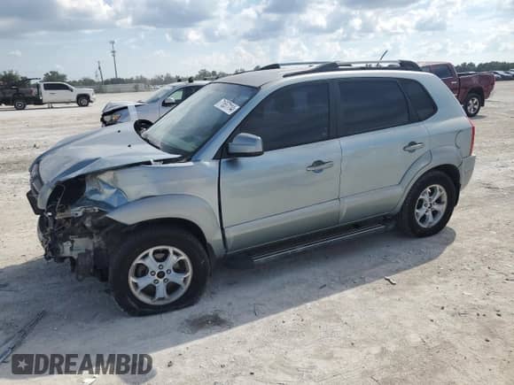 2009 Hyundai Tucson with VIN KM8JN12B59U971278, listed as a Copart auction lot 71657114 with 230,390 mi miles and Salvage title. Bid and sale history available at DreamBid. Image 1.