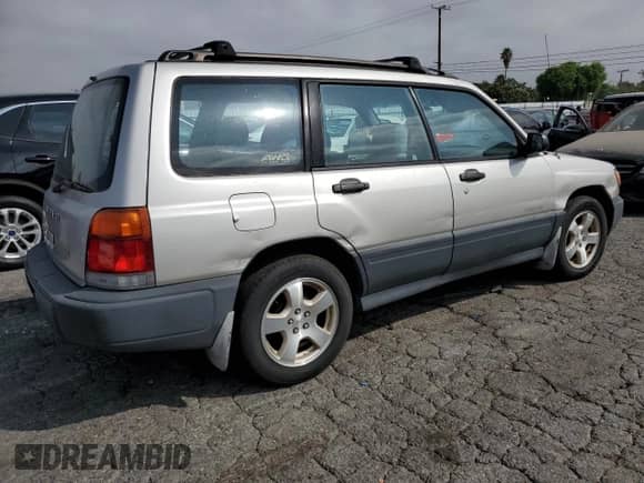 1999 Subaru Forester L with VIN JF1SF6353XH727555, listed as a Copart auction lot 80185275 with 186,950 mi miles and Salvage title. Bid and sale history available at DreamBid. Image 3.