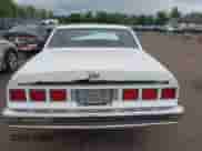 1985 Chevrolet Caprice z VIN 2G1BN69H2F9102803, wystawiony jako IAAI lot #43006585 z przebiegiem 77 371 mil mil oraz . Historia ofert i sprzedaży dostępna na DreamBid. Obrazek 16.