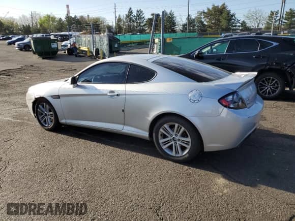 2007 Hyundai Tiburon GS with VIN KMHHM66DX7U246220, listed as a Copart auction lot 53555715 with 105,305 mi miles and Salvage title. Bid and sale history available at DreamBid. Image 2.