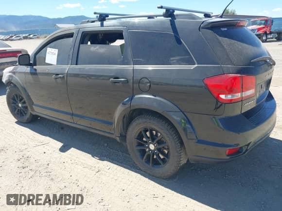 2013 Dodge Journey SXT with VIN 3C4PDCBB7DT729771, listed as a IAAI auction lot 42729241 with Not provided miles and . Bid and sale history available at DreamBid. Image 3.