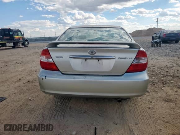 2004 Toyota Camry LE with VIN JTDBE32K740271038, listed as a Copart auction lot 82108005 with 220,896 mi miles and Salvage title. Bid and sale history available at DreamBid. Image 6.