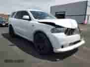 2013 Dodge Durango R/T with VIN 1C4SDHCT0DC556878, listed as a Copart auction lot 70955065 with 187,119 mi miles and Salvage title. Bid and sale history available at DreamBid. Image 4.