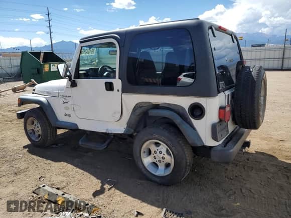 2000 Jeep Wrangler Sport z VIN 1J4FA49SXYP700513, wystawiony jako Copart lot #80155385 z przebiegiem 129 836 mil mil oraz Szkoda całkowita • Salvage title. Historia ofert i sprzedaży dostępna na DreamBid. Obrazek 2.