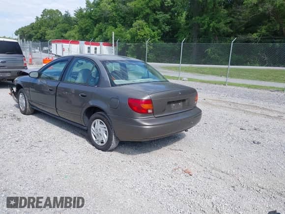 2001 Saturn SL with VIN 1G8ZF52851Z238231, listed as a IAAI auction lot 42454503 with 144,748 mi miles and . Bid and sale history available at DreamBid. Image 3.