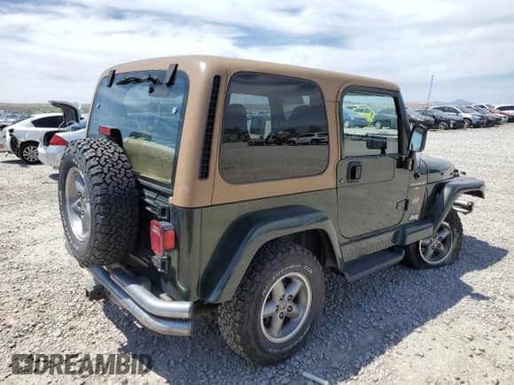 1997 Jeep Wrangler Sahara with VIN 1J4FY49S9VP452813, listed as a Copart auction lot 58079815 with 76,773 mi miles and Salvage title. Bid and sale history available at DreamBid. Image 3.