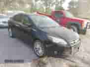 2014 Ford Focus Titanium with VIN 1FADP3J22EL263701, listed as a IAAI auction lot 43337282 with 158,977 mi miles and . Bid and sale history available at DreamBid. Image 1.