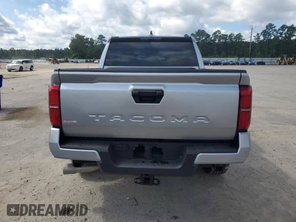 2024 Toyota Tacoma SR5 with VIN 3TMKB5FN1RM023512, listed as a Copart auction lot 68438505 with 5,994 mi miles and Salvage title. Bid and sale history available at DreamBid. Image 6.