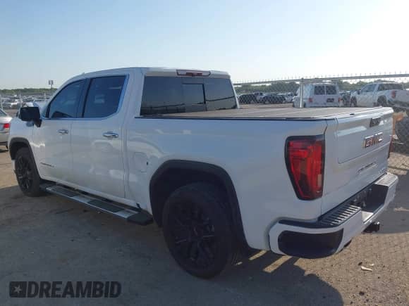 2023 GMC Sierra 1500 Denali z VIN 3GTUUGED4PG345211, wystawiony jako IAAI lot #42995625 z przebiegiem 63 396 mil mil oraz . Historia ofert i sprzedaży dostępna na DreamBid. Obrazek 3.