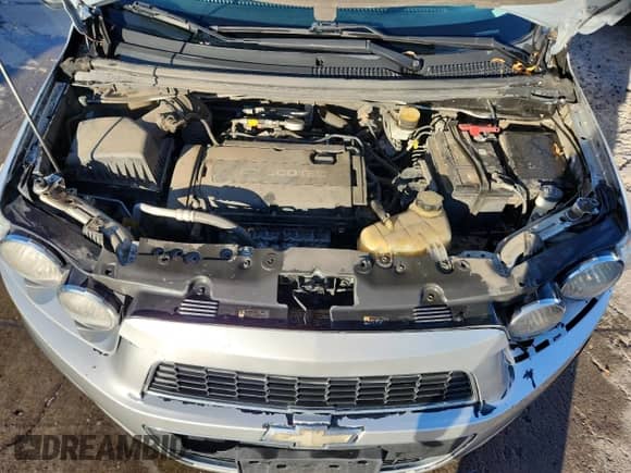 2012 Chevrolet Sonic LT z VIN 1G1JC5SH6C4134268, wystawiony jako Copart lot #87025085 z przebiegiem 157 335 mil mil oraz Szkoda całkowita • Salvage title. Historia ofert i sprzedaży dostępna na DreamBid. Obrazek 11.