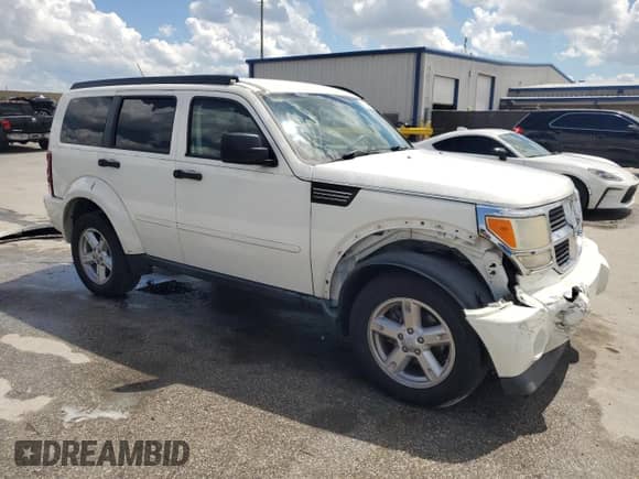 2007 Dodge Nitro SXT with VIN 1D8GU28K27W661610, listed as a Copart auction lot 81045195 with 153,517 mi miles and Salvage title. Bid and sale history available at DreamBid. Image 4.