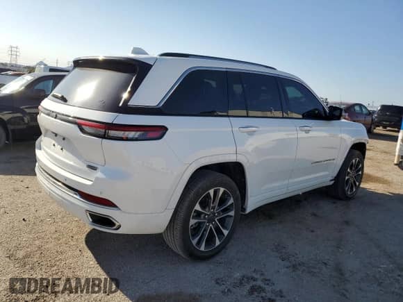 2023 Jeep Grand Cherokee Overland z VIN 1C4RJHDG9P8741074, wystawiony jako Copart lot #50078695 z przebiegiem 26 830 mil mil oraz Szkoda całkowita • Salvage title. Historia ofert i sprzedaży dostępna na DreamBid. Obrazek 3.