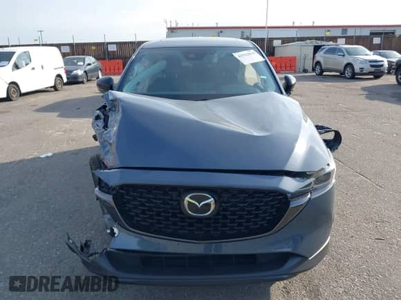 2025 Mazda CX-5 S Carbon Edition z VIN JM3KFBCM3S0689995, wystawiony jako IAAI lot #42922834 z przebiegiem 2 087 mil mil oraz . Historia ofert i sprzedaży dostępna na DreamBid. Obrazek 13.