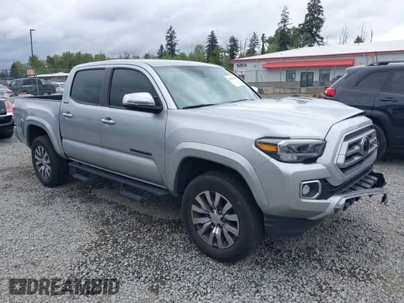 2022 Toyota Tacoma Limited with VIN 3TMGZ5AN2NM504615, listed as a IAAI auction lot 42261699 with 58,141 mi miles and . Bid and sale history available at DreamBid. Image 1.