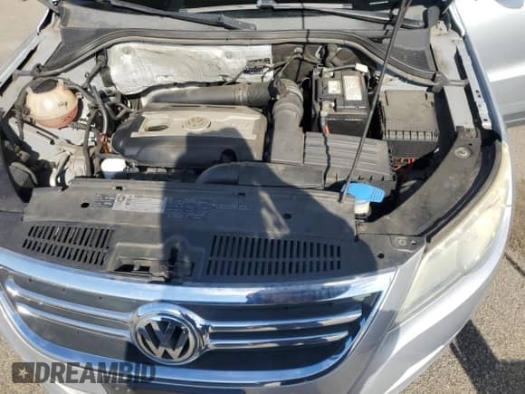2010 Volkswagen Tiguan SE с VIN WVGBV7AX5AW522938, выставлен на аукционе Copart как лот 71200465 с пробегом 105 392 миль миль и Списание • Salvage title. История ставок и продаж доступна на DreamBid. Изображение 11.