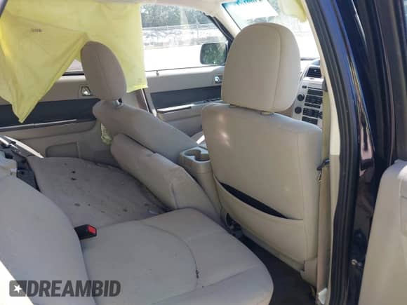 2009 Mercury Mariner Hybrid with VIN 4M2CU29359KJ17577, listed as a IAAI auction lot 43091811 with 247,830 mi miles and . Bid and sale history available at DreamBid. Image 8.