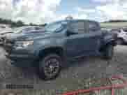 2020 Chevrolet Colorado 4WD ZR2 with VIN 1GCGTEEN0L1143245, listed as a Copart auction lot 63973095 with 163,617 mi miles and Salvage title. Bid and sale history available at DreamBid. Image 1.