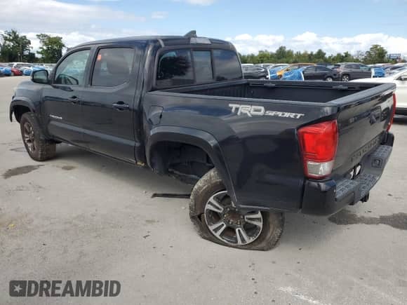 2016 Toyota Tacoma TRD Sport with VIN 3TMAZ5CN2GM014309, listed as a Copart auction lot 82462545 with 148,928 mi miles and Salvage title. Bid and sale history available at DreamBid. Image 2.