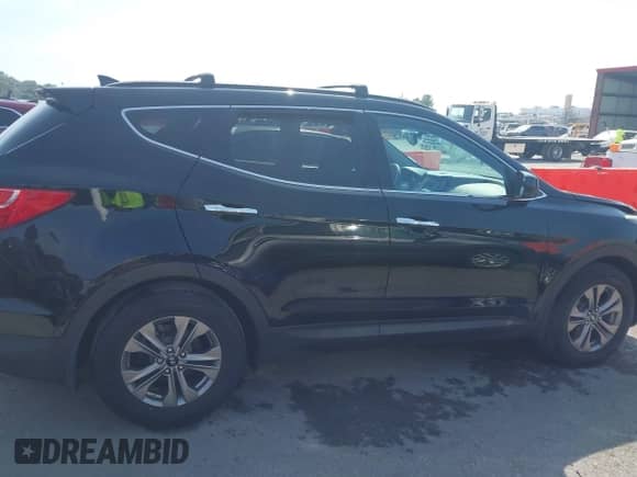 2015 Hyundai Santa Fe z VIN 5XYZU3LB0FG284923, wystawiony jako IAAI lot #43246696 z przebiegiem 96 991 mil mil oraz . Historia ofert i sprzedaży dostępna na DreamBid. Obrazek 13.