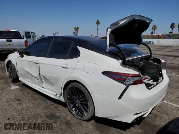 2021 Toyota Camry Hybrid XSE with VIN 4T1K31AK4MU023460, listed as a Copart auction lot 70783095 with 93,200 mi miles and Salvage title. Bid and sale history available at DreamBid. Image 2.