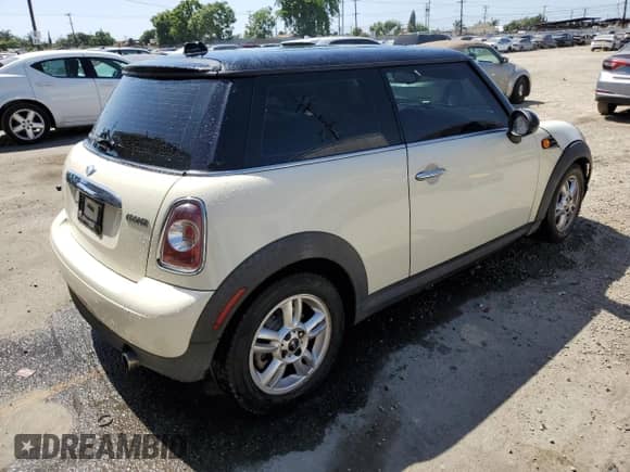 2013 MINI Hardtop with VIN WMWSU3C52DT680782, listed as a Copart auction lot 61779515 with 94,378 mi miles and Salvage title. Bid and sale history available at DreamBid. Image 3.
