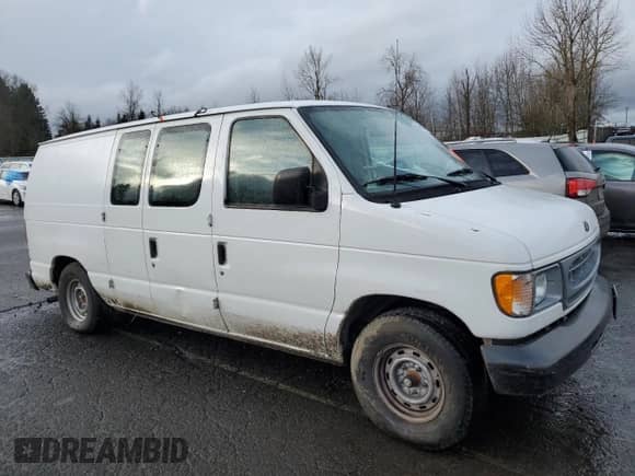 2001 Ford Econoline Cargo with VIN 1FTRE14251HA20435, listed as a Copart auction lot 44000085 with 69,015 mi miles and Salvage title. Bid and sale history available at DreamBid. Image 4.