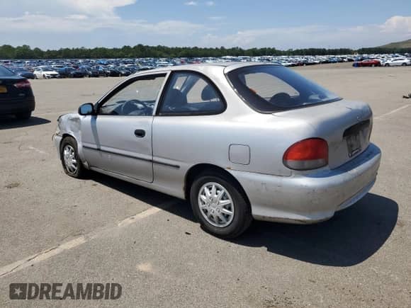 1999 Hyundai Accent L z VIN KMHVD14N9XU497814, wystawiony jako Copart lot #60374665 z przebiegiem 287 585 mil mil oraz Szkoda całkowita • Salvage title. Historia ofert i sprzedaży dostępna na DreamBid. Obrazek 2.