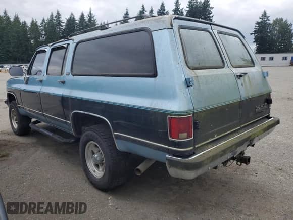 1991 Chevrolet Suburban с VIN 1GNGV26K9MF149425, выставлен на аукционе Copart как лот 60575915 с пробегом 168 594 миль миль и Чистый • Clean title. История ставок и продаж доступна на DreamBid. Изображение 2.