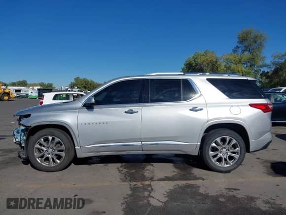 2018 Chevrolet Traverse Premier with VIN 1GNEVJKW0JJ161921, listed as a IAAI auction lot 43267948 with 136,557 mi miles and . Bid and sale history available at DreamBid. Image 15.