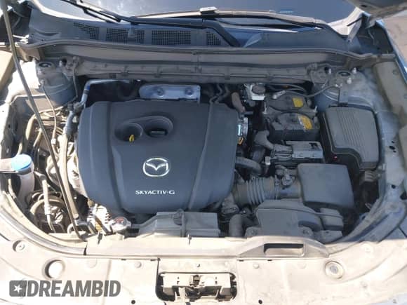2022 Mazda CX-5 S Carbon Edition z VIN JM3KFBCM7N1601447, wystawiony jako IAAI lot #42463014 z przebiegiem 37 126 mil mil oraz . Historia ofert i sprzedaży dostępna na DreamBid. Obrazek 10.