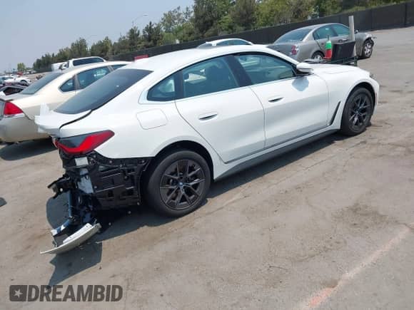 2024 BMW i4 eDrive35 with VIN WBY43AW05RFS59694, listed as a IAAI auction lot 42876740 with 21,805 mi miles and . Bid and sale history available at DreamBid. Image 4.