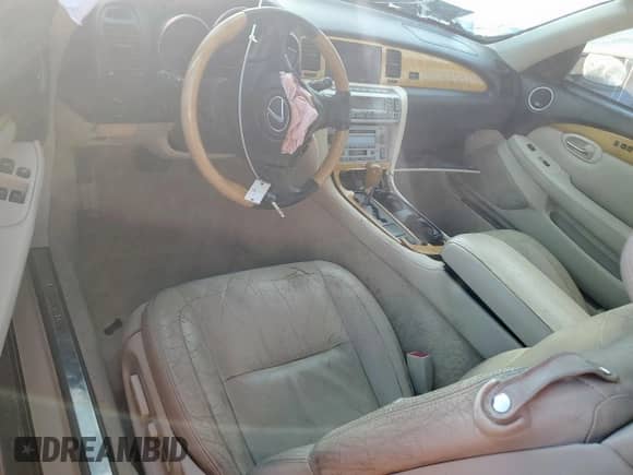 2003 Lexus SC 430 с VIN JTHFN48Y230037437, выставлен на аукционе Copart как лот 82165405 с пробегом 98 997 миль миль и Списание • Salvage title. История ставок и продаж доступна на DreamBid. Изображение 8.