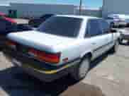 1991 Toyota Camry z VIN 4T1VV21E8MU047512, wystawiony jako IAAI lot #42854666 z przebiegiem 123 306 mil mil oraz . Historia ofert i sprzedaży dostępna na DreamBid. Obrazek 4.