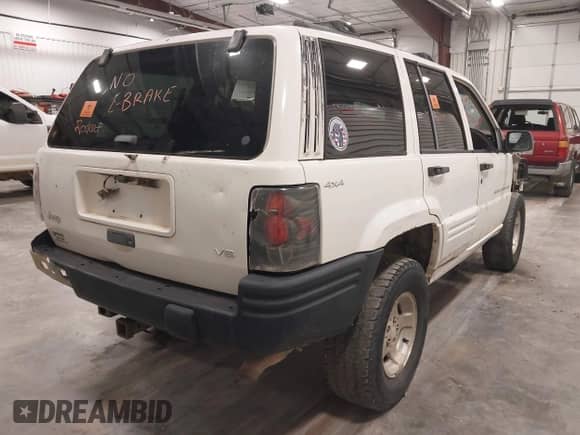 1998 Jeep Grand Cherokee Laredo z VIN 1J4GZ48Y3WC230722, wystawiony jako IAAI lot #43373852 z przebiegiem Nie podano mil oraz . Historia ofert i sprzedaży dostępna na DreamBid. Obrazek 4.