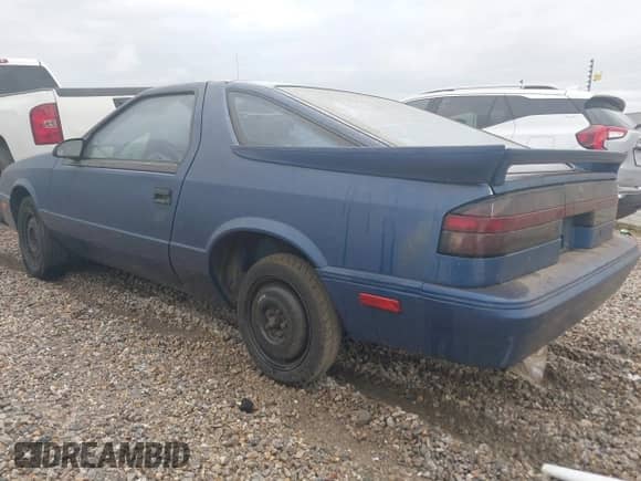 1990 Dodge Daytona with VIN 1B3XG24K8LG509073, listed as a IAAI auction lot 41806829 with 143,972 mi miles and . Bid and sale history available at DreamBid. Image 3.