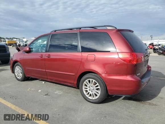 2010 Toyota Sienna XLE с VIN 5TDYK4CC1AS342159, выставлен на аукционе Copart как лот 84412115 с пробегом 214 042 миль миль и Списание • Salvage title. История ставок и продаж доступна на DreamBid. Изображение 2.