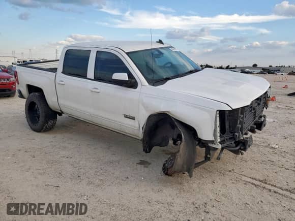 2017 Chevrolet Silverado 1500 LT with VIN 3GCPCREH7HG232224, listed as a Copart auction lot 84614215 with 104,344 mi miles and Salvage title. Bid and sale history available at DreamBid. Image 4.