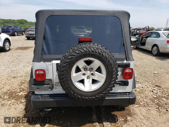 2004 Jeep Wrangler Rubicon with VIN 1J4FA69S24P769671, listed as a Copart auction lot 67028605 with 142,794 mi miles and Salvage title. Bid and sale history available at DreamBid. Image 6.