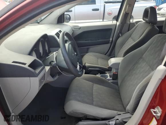 2007 Dodge Caliber with VIN 1B3JB28B97D503059, listed as a Copart auction lot 67860335 with 169,452 mi miles and Salvage title. Bid and sale history available at DreamBid. Image 7.