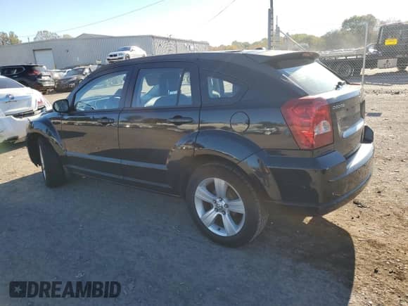2010 Dodge Caliber SXT with VIN 1B3CB4HA9AD635046, listed as a Copart auction lot 82397075 with 190,652 mi miles and Salvage title. Bid and sale history available at DreamBid. Image 2.