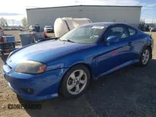2006 Hyundai Tiburon SE с VIN KMHHN65D06U230928, выставлен на аукционе Copart как лот 72745854 с пробегом 246 837 миль миль и Чистый • Clean title. История ставок и продаж доступна на DreamBid. Изображение 1.